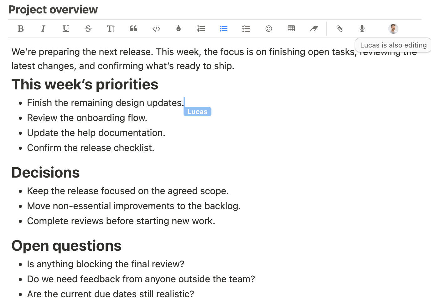 Two people editing the same Breeze project note, with a named cursor showing where a teammate is working